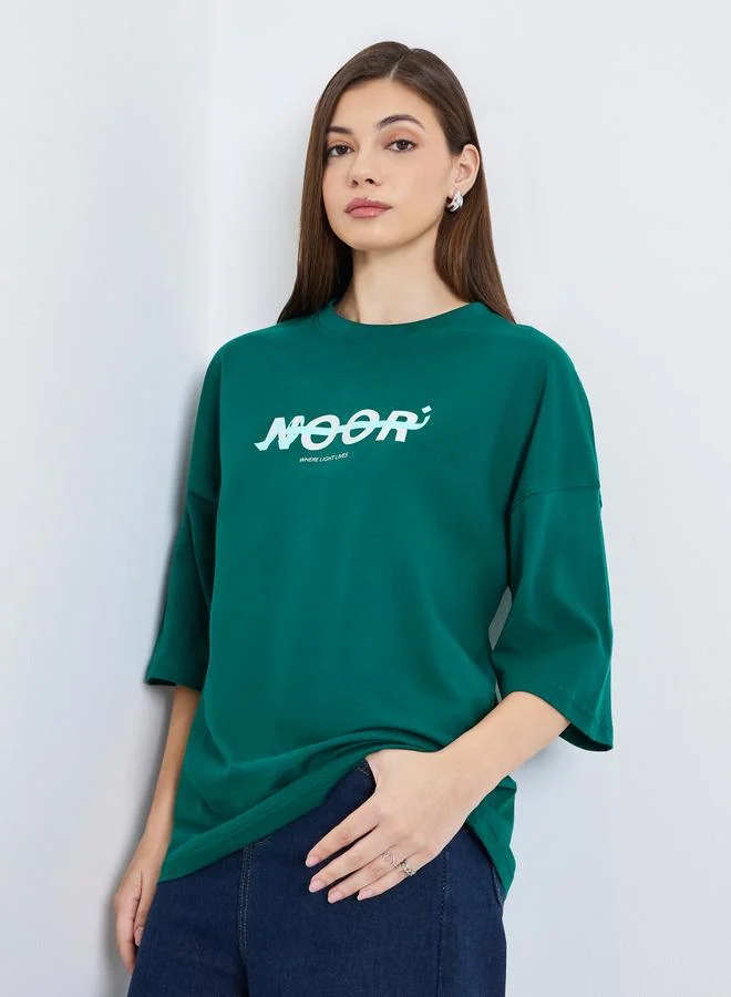 Styli Women Dark Green Slogan Print Oversized T-Shirt
